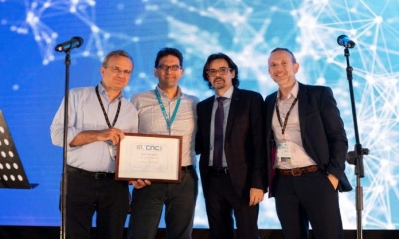 P. Demestichas (1st from the left), WINGS ICT Solutions and 5G-MOBIX partner, receives the Best Booth Award at EuCNC 2019